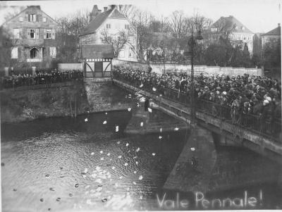 Symbolic entry into maturity - Symbolic entry into maturity: old school books are thrown into the River Ems from a bridge in Rheine, 1929