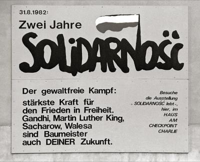 Advert for the exhibition commemorating two years of Solidarność on the museum wall - House at Checkpoint Charlie; border crossing to East Berlin in Friedrichstraße.