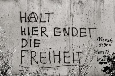 … Berlin 1984 - Graffiti on the Wall: Freedom ends here.