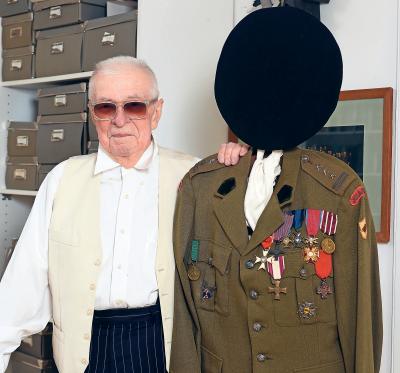 Andrzej Wirth in his apartment in Berlin - Andrzej Wirth in his apartment next to the officer uniform of his father, who had belonged to the Polish government in exile in the Second World War in London. 