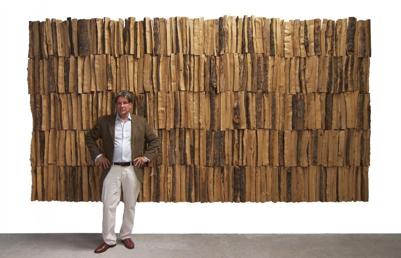 Jan de Weryha standing in front of his work “Wooden Panel” (2001)
