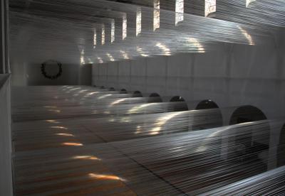 100 Kilometres, 2013. Strips of synthetic material, metal, W = 1250 cm,  H = 1300 cm,  D = 3000 cm, Kunstkirche Christ-König, Bochum (Danuta Karsten exhibition: “100 Kilometer”)