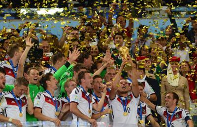 Lukas Podolski (with the Cup) after winning the 2014 World Cup