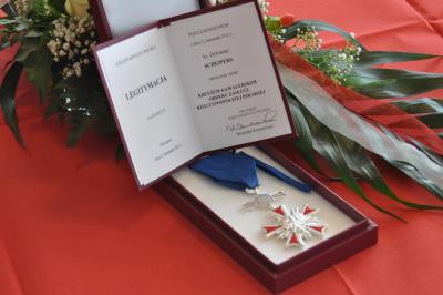 The certificate of the Order containing the signature of the President of the Republic of Poland, Bronisław Komorowski
