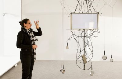 Karina Smigla-Bobinski standing next to her interactive video installation SIMULACRA, MoTA Museum of Transitory Art, Ljubljana, 2013.